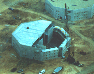 roof is lowered by crane onto stacked cells