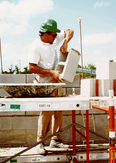 Inmate laying block in construction of Dan River Prison Work Farm