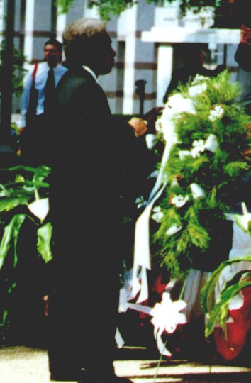 Secretary Beck places pin on State Employee Memorial wreath.