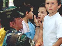 Officer Williams with children in Moldova