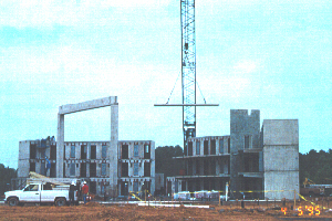 cranes lift pre-cast cells into place