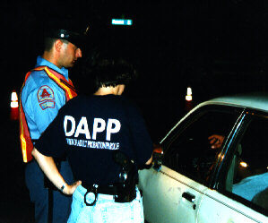 Probation officer works with Raleigh policeman in a traffic stop.
