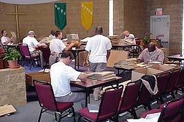 Inmates fold grocery bags in Craggy Chapel