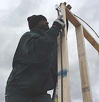 Inmate works on wall panel
