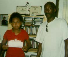 Inmate presents check to Daija Rivers