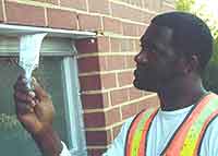 Inmate painting window