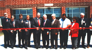 Gov. Hunt, Secretary Jarvis and others cut the ribbon to open Hyde Correctional Center