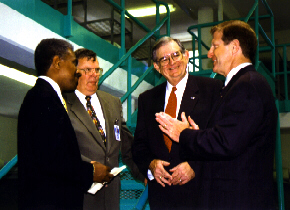 Superintendent Chester shows new dorm to Secretary Jarvis and correction managers