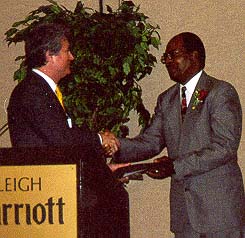 JB. French receives the Order of the Long Leaf Pine from Franklin Freeman